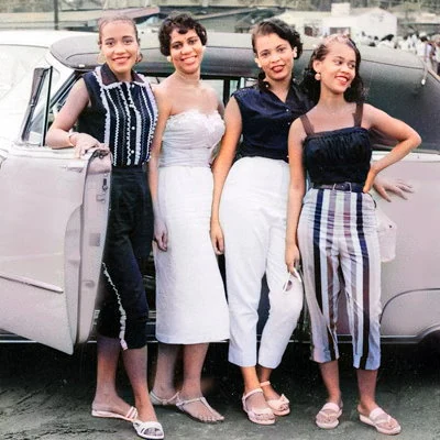 Four young women pose by their car in Annapolis, Maryland.