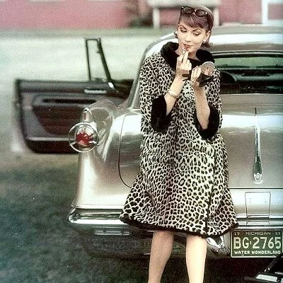 A model preps for a photo shoot in 1959.