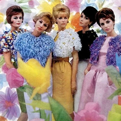Models pose in designer Arnold Scaasi's spring fashion line.