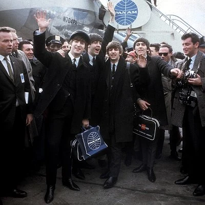 Following a year of Beatlemania in the UK, Liverpool group The Beatles arrive in the USA. They appear several times on The Ed Sullivan show, drawing huge ratings and at one point have the top five singles on the Billboard Top 40 chart.