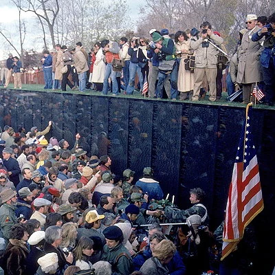 The Vietnam War Memorial opens to the public in Washington D.C. The controversial design features a 246 foot long black granite wall with over 57,000 names of deceased veterans etched in the stone.