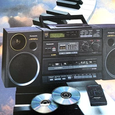Compact discs, or CD's, outsell vinyl records for the first time, but cassette tapes remain the dominant format for recorded music.