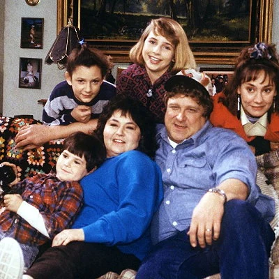The television sitcom Roseanne debuts on ABC where it runs until 1997. The show stars and is co-created by comedian Roseanne Barr who plays the matriarch of the working class Conner family.