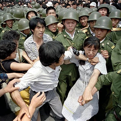 Pro-reform student led protests in Beijing's Tiananmen Square begin in April and end June 4th with Chinese troops forcibly removing protesters resulting in hundreds of deaths and thousands of injuries. Martial law is declared and armed troops supported by tanks occupy central Beijing.