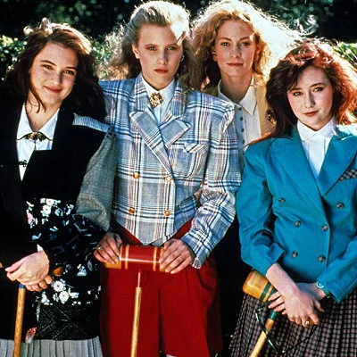 Heathers is a dark, satirical film about high school starring Winona Ryder, Christian Slater and Shannon Doherty. The movie is later adapted into a musical and a television series.