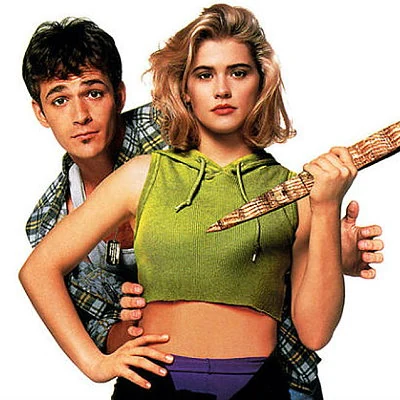 Kristy Swanson and Luke Perry star in the dark comedy film Buffy and the Vampire Slayer. The film would later be made into a TV series.